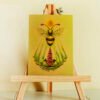 Gold Pearlescent Art Postcard of Fantasy Honey Bee with Sun Disc, Sun Beams and Foxglove Plant (Digitalis) sitting on easel