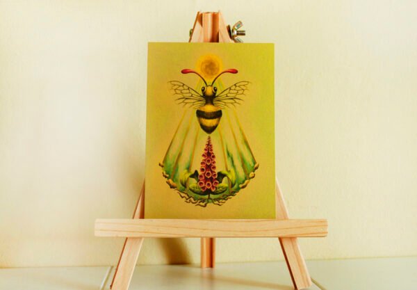 Gold Pearlescent Art Postcard of Fantasy Honey Bee with Sun Disc, Sun Beams and Foxglove Plant (Digitalis) sitting on easel