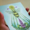 Close Up of Silver Pearlescent Fantasy Honey Bee Art Postcard showing glitter shine and magenta colour details