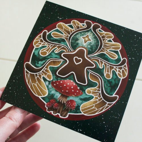 Square Christmas Card of digital painting “Gingerbread Faerie” by Imogen Smid held by the artist to demonstrate the size