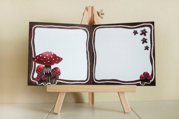 Inside of Christmas card: no text, with Gingerbread border, fly agaric mushroom illustrations and small gingerbread details