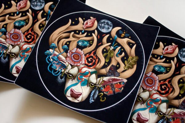 Close up of Round Sticker of Illustration “The Stag’s Head” featuring four nature elements: earth, air, fire, and water