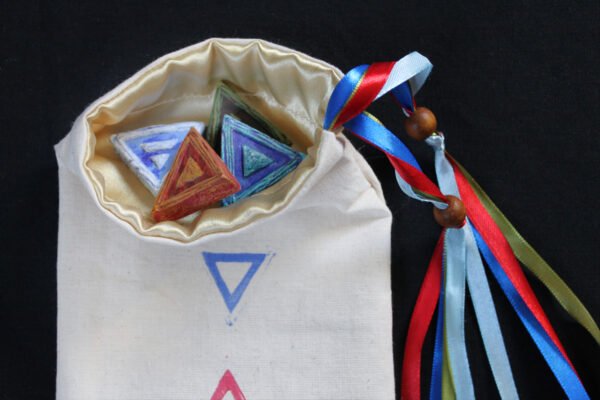 Unbleached cotton alchemy pouch with cream poly-satin lining, earth, air, fire and water sigil altar amulets sitting in bag