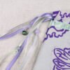Close Up of bee Pouch with mint, purple and grey ribbons, iridescent purple, silver plastic beads and green glass bead charms