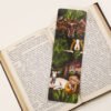 Horned God Myths bookmark with green, golden yellow and plum purple colours on a black and white text page of open book