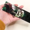 Artist holding Bookmark of Illustration “the Hooded Man” featuring legendary hero Robin Hood of English Nottingham county