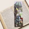 White Rabbit of Wonderland, bookmark with large magical toadstools and mushroom on a black and white text page of open book