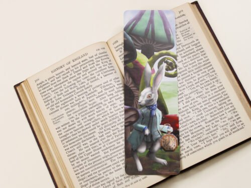 White Rabbit of Wonderland, bookmark with large magical toadstools and mushroom on a black and white text page of open book