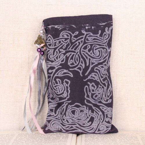Standing purple cotton pouch with hand printed Celtic tree pattern, printed using a hand carved lino stamp by Imogen Smid