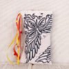 Standing white pouch with hand printed Mythology leaf flora pattern, printed using hand carved lino stamps by Imogen Smid
