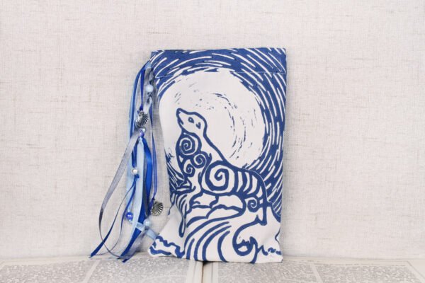 Standing white cotton pouch with hand printed Selkie pattern, printed using a hand carved lino stamp by Imogen Smid