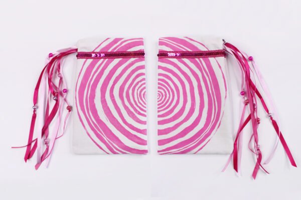 Hot Pink coloured printing on both sides of Tree ring bag, inspired by ancient magic trees and the rings inside their trunks