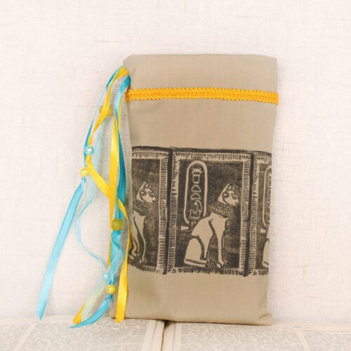 Standing sandy taupe cotton pouch with hand printed Bastet pattern, printed using a hand carved lino stamp by Imogen Smid