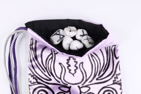 Violet Poly-Satin Cernunnos pouch with black cotton lining, white rune stones that spell Imogen are sitting in the pouch