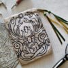 Hand printed pouch with, lino cutters, forged scissors and hand carved lino stamp which was used for printing this pouch