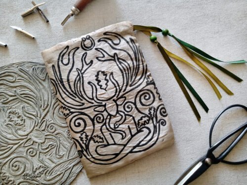 Hand printed pouch with, lino cutters, forged scissors and hand carved lino stamp which was used for printing this pouch