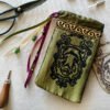 Hand printed pouch with, lino cutters, forged scissors and hand carved lino stamp which was used for printing this pouch