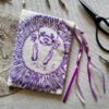 Hand printed pouch with, lino cutters, forged scissors and hand carved lino stamp which was used for printing this pouch