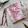 Hand printed pouch with, lino cutters, forged scissors and hand carved lino stamp which was used for printing this pouch