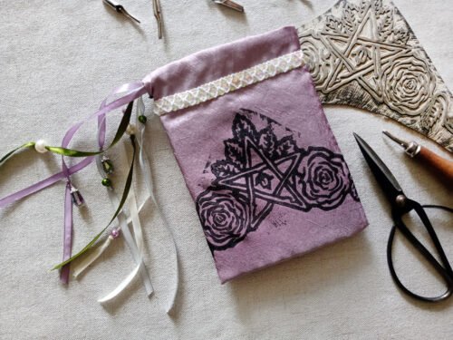 Hand printed pouch with, lino cutters, forged scissors and hand carved lino stamp which was used for printing this pouch