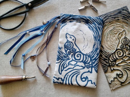 Hand printed pouch with, lino cutters, forged scissors and hand carved lino stamp which was used for printing this pouch