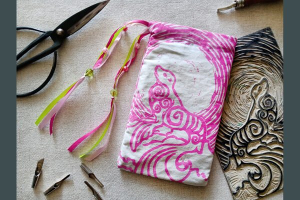 Hand printed pouch with, lino cutters, forged scissors and hand carved lino stamp which was used for printing this pouch