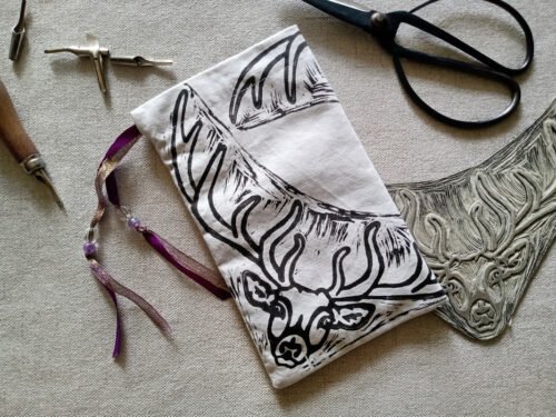 Hand printed pouch with, lino cutters, forged scissors and hand carved lino stamp which was used for printing this pouch