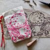 Hand printed pouch with, lino cutters, forged scissors and hand carved lino stamp which was used for printing this pouch